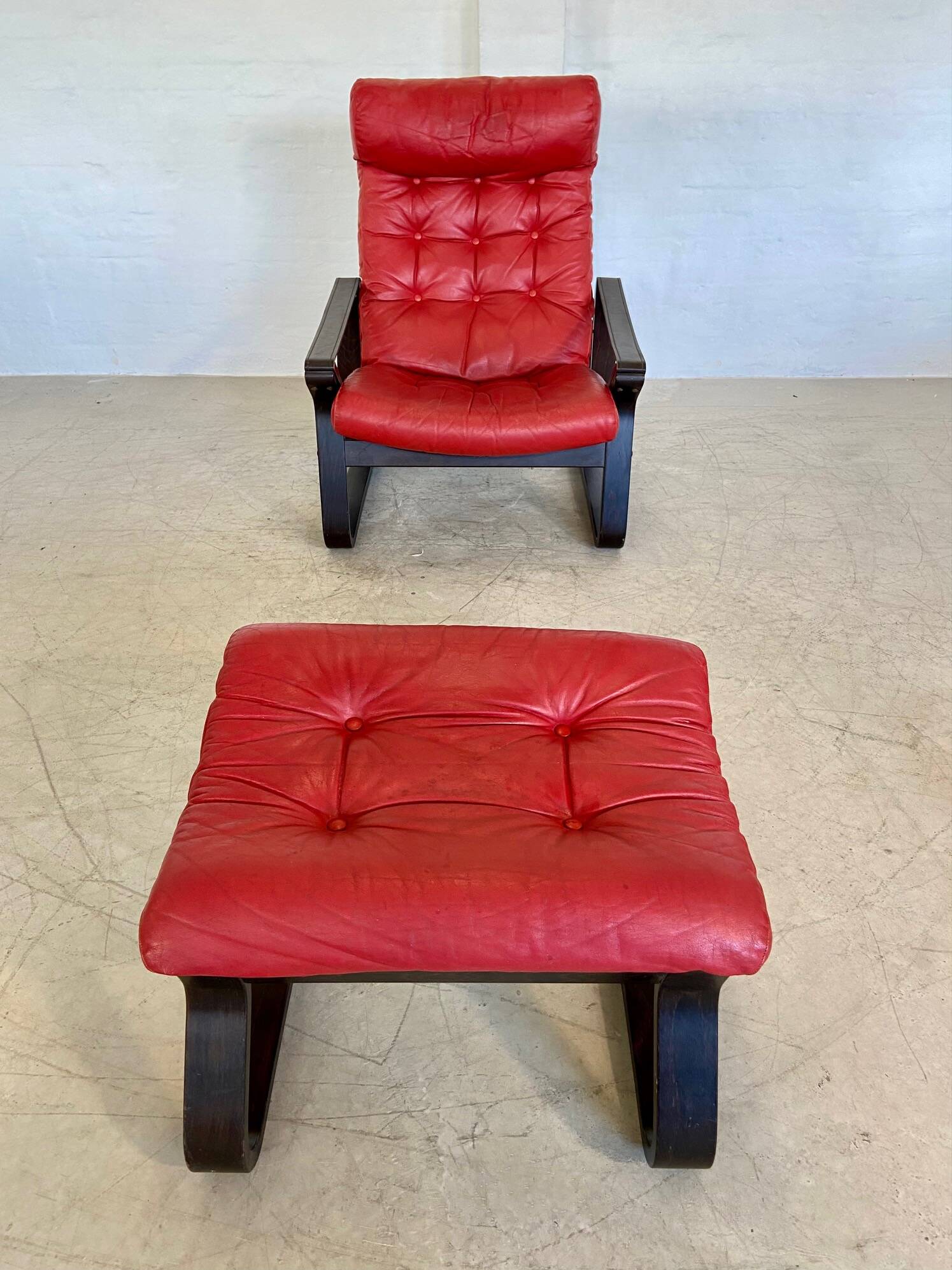 Vintage danish retro reclining lounge chair & stool in red leather by komfo