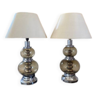 pair of smoked glass and chrome lamps