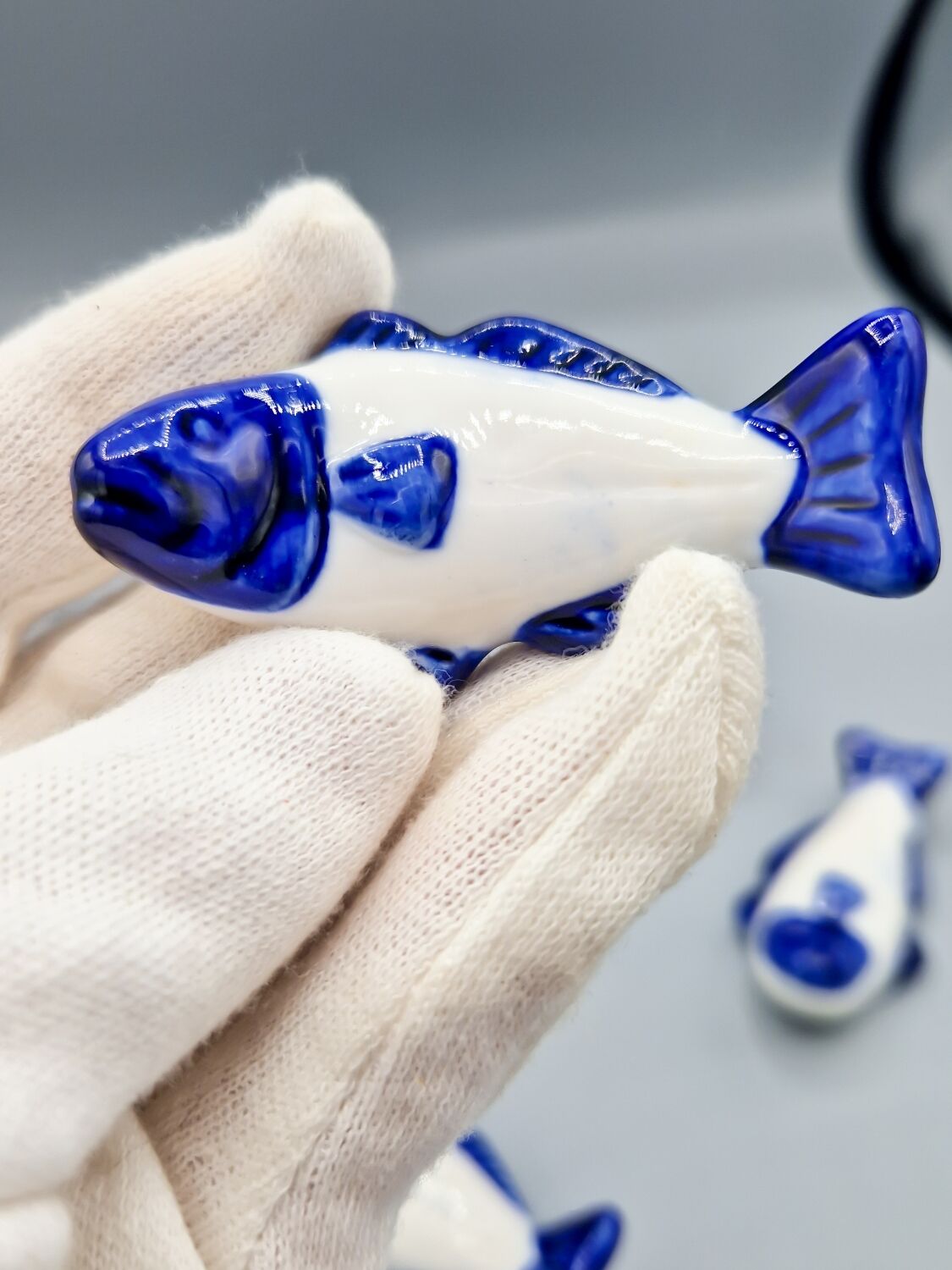 Set of 11 vintage blue and white porcelain fish knife rests.