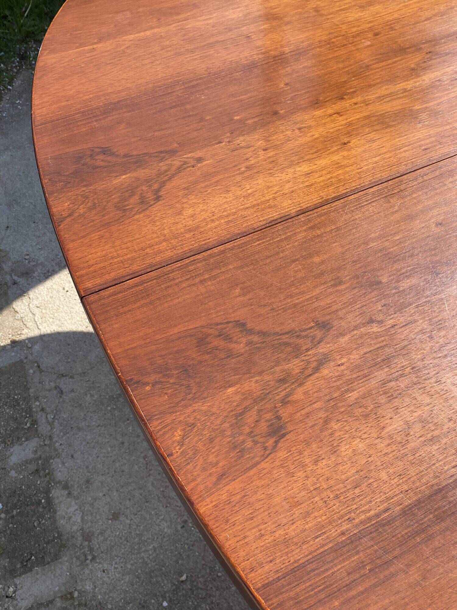 Baumann round oval extendable Scandinavian table in rosewood with 2 extensions.