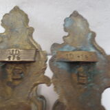 Pair of embraces in brass or bronze