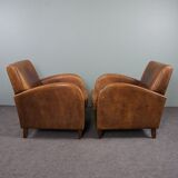 Paire de fauteuils en cuir de mouton