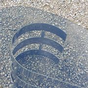 Oval coffee table of the 70s chromed metal base in s smoked glass top