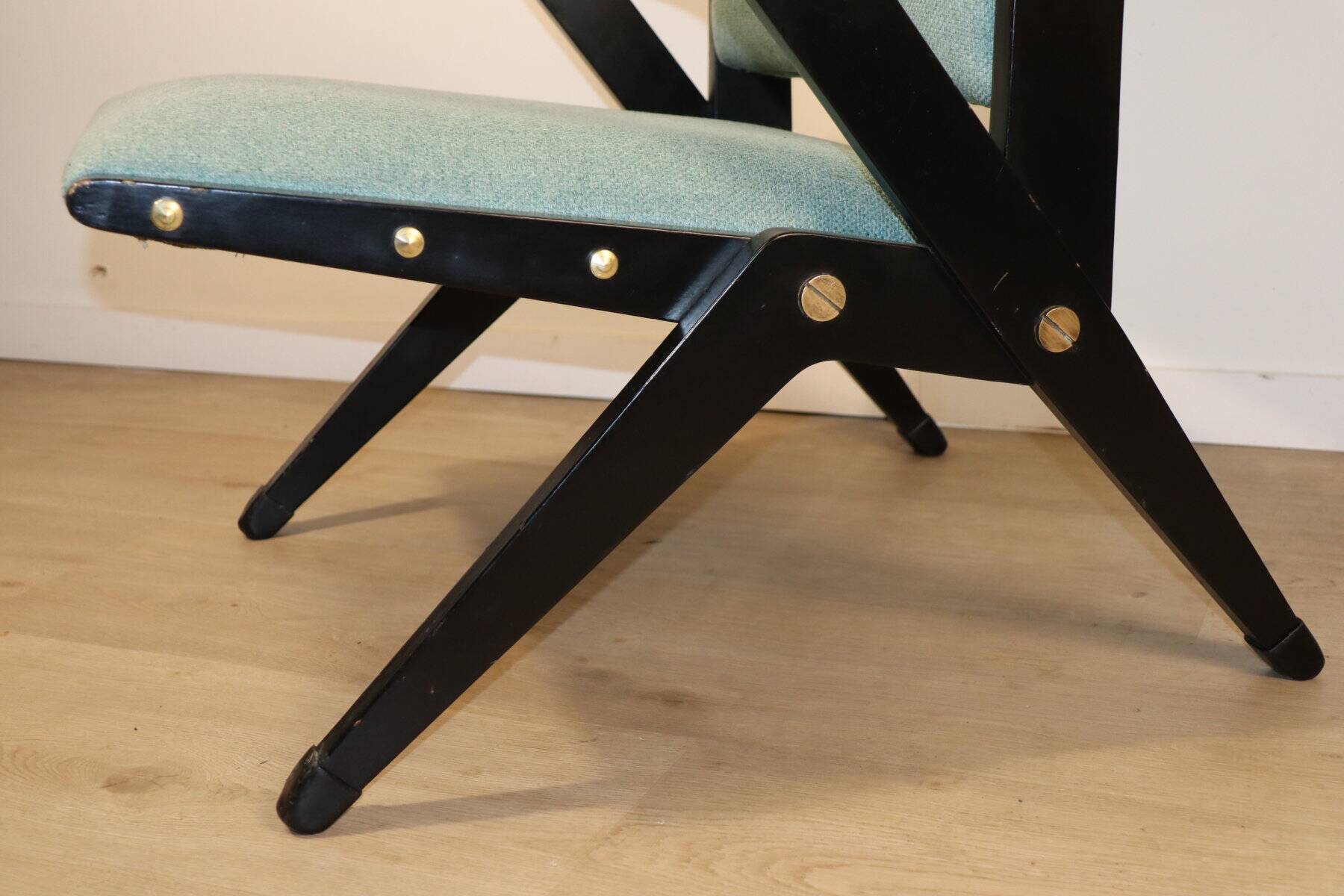 Vintage armchair from the 1960s in black wood and fabric.