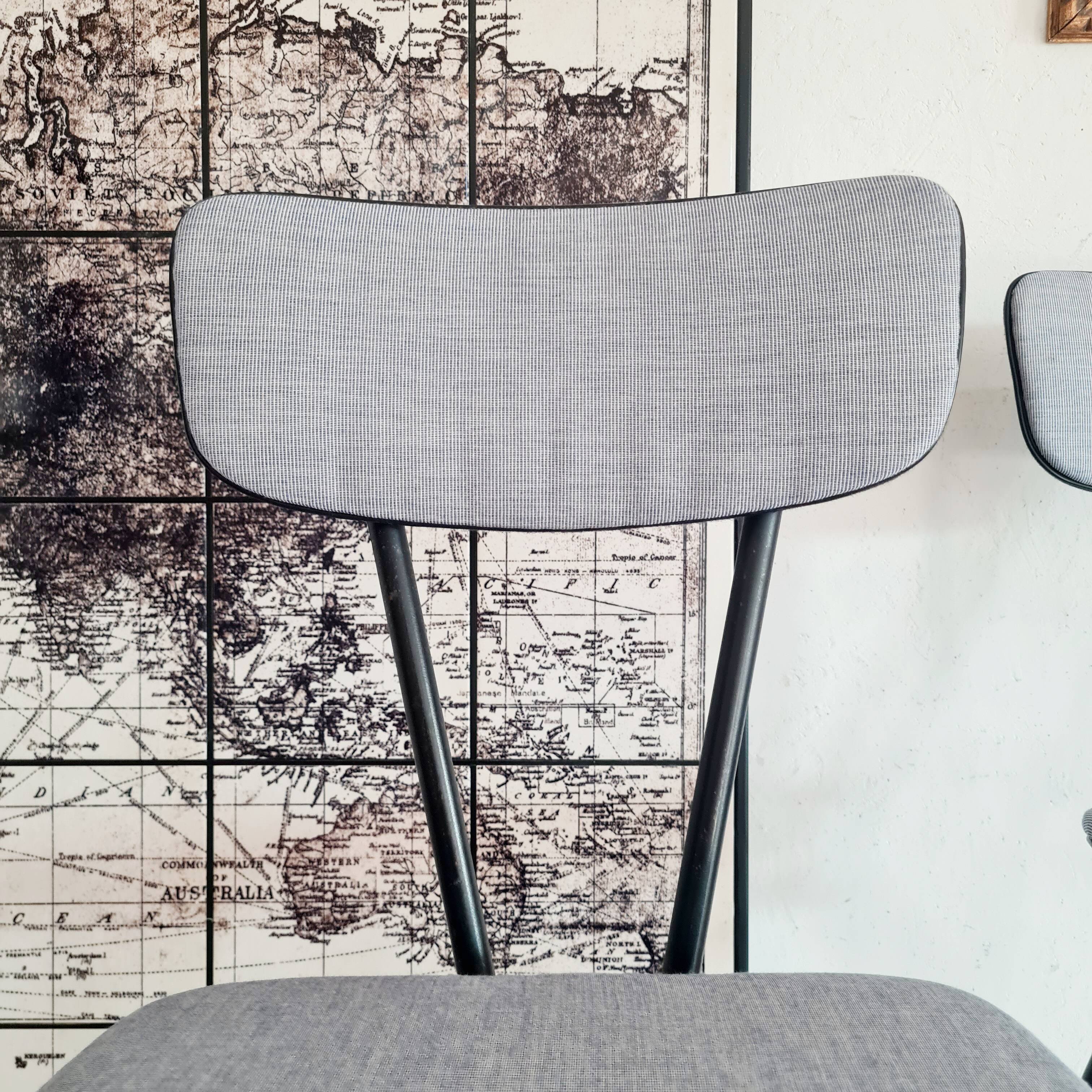 Pair of black metal and blue fabric chairs