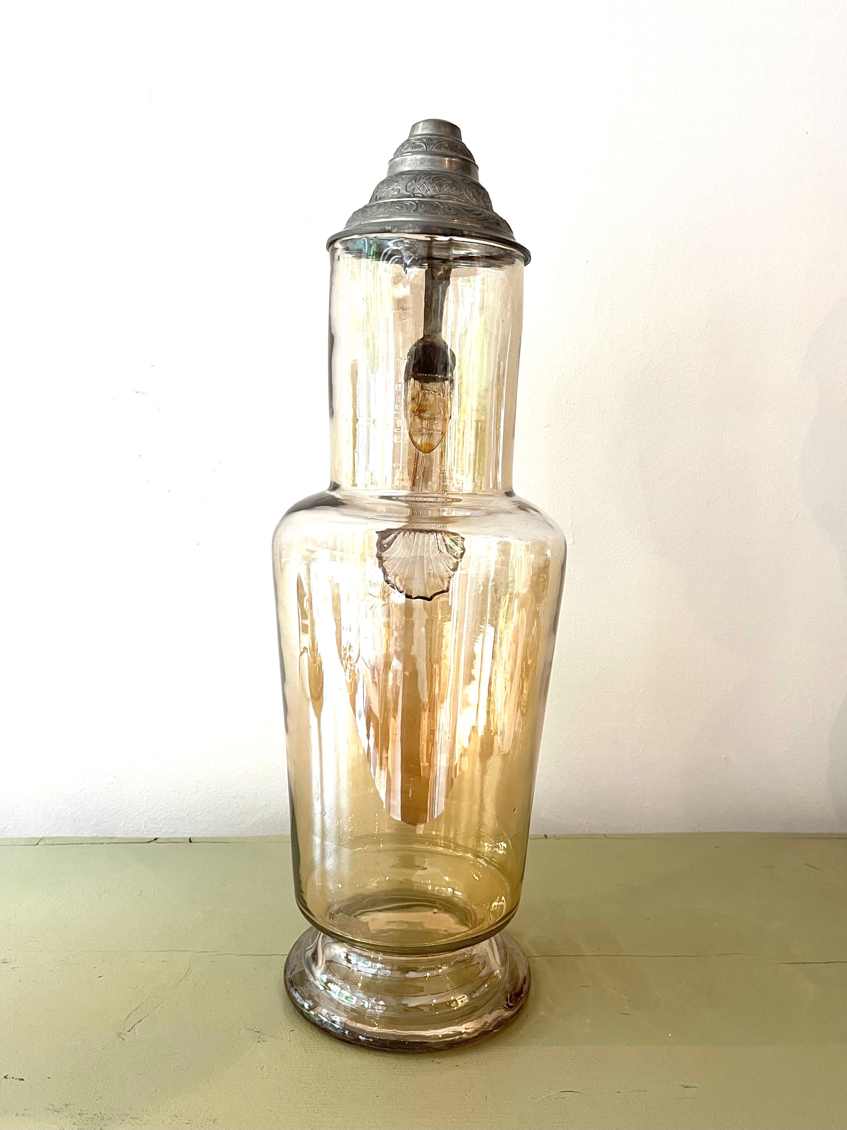 Vintage glass and tin jug