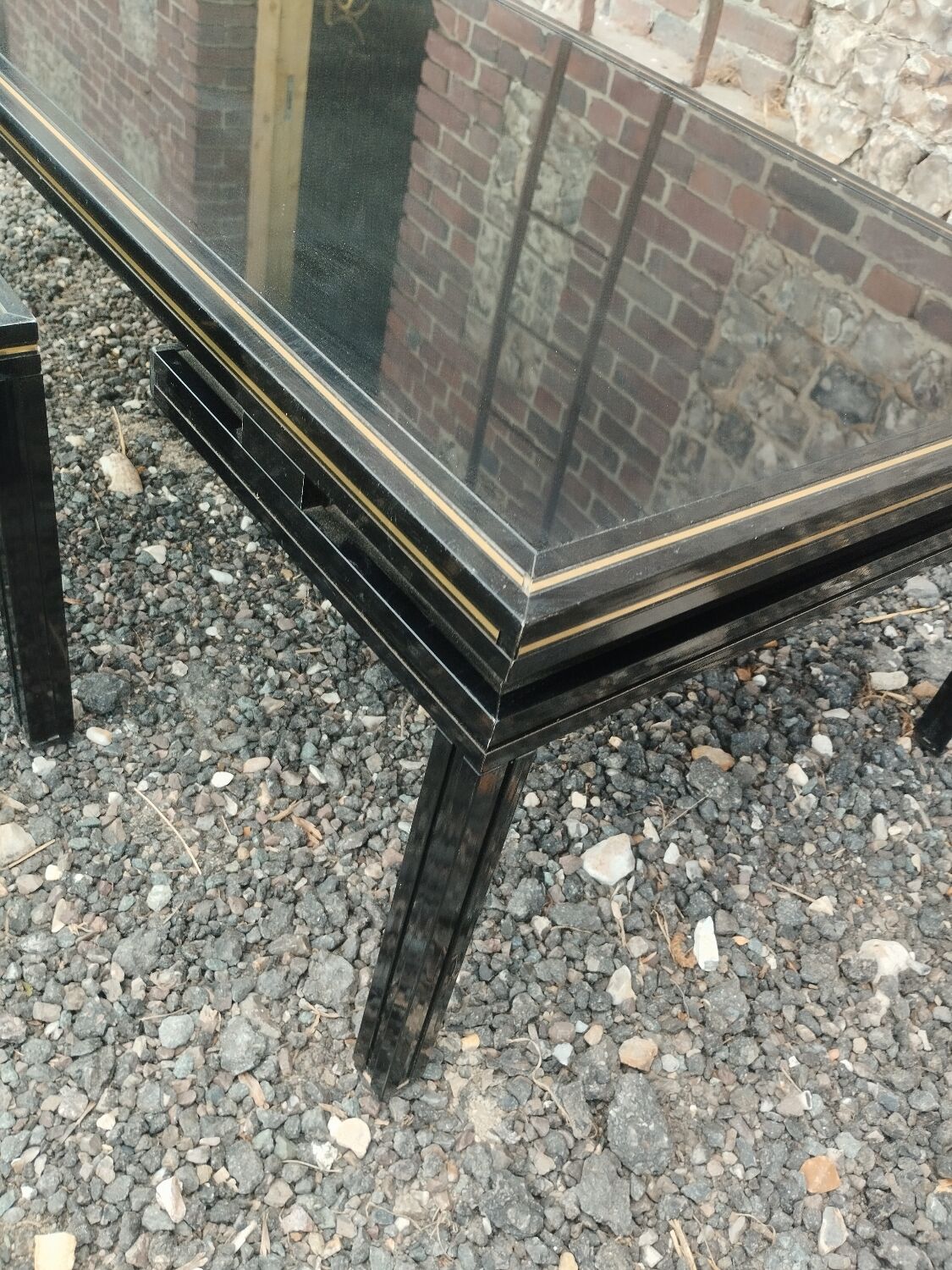 Vintage metal coffee table with glass top.