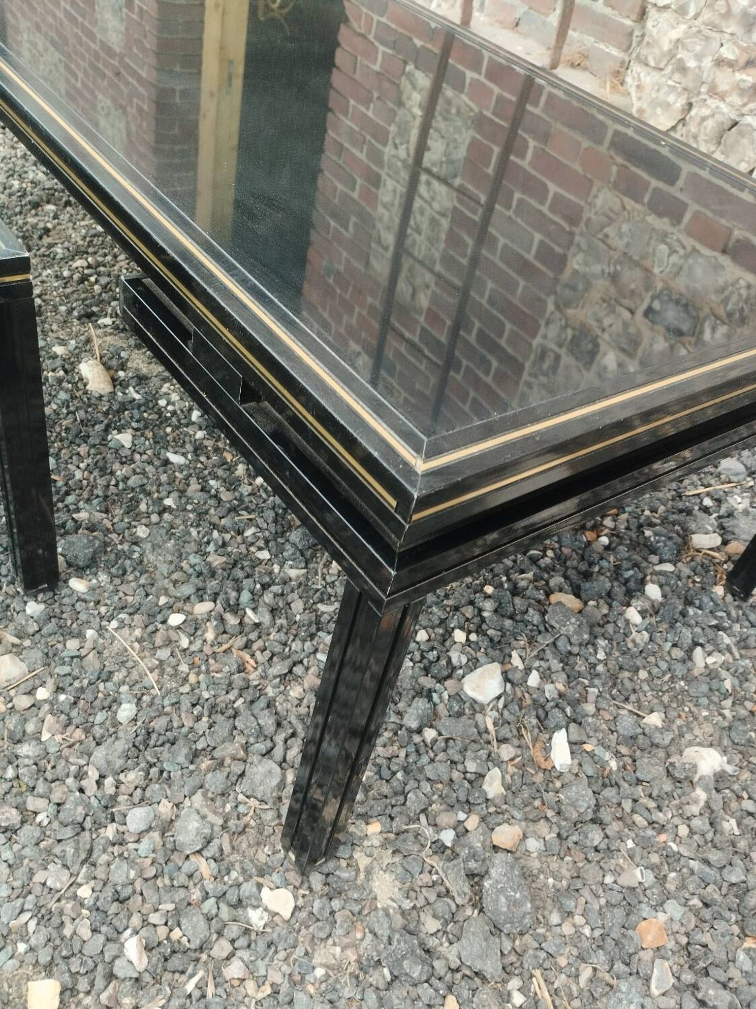 Vintage metal coffee table with glass top.