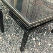 Vintage metal coffee table with glass top.