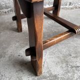 Brutalist dark brown solid wood armchair with natural rattan seat and cognac leather back