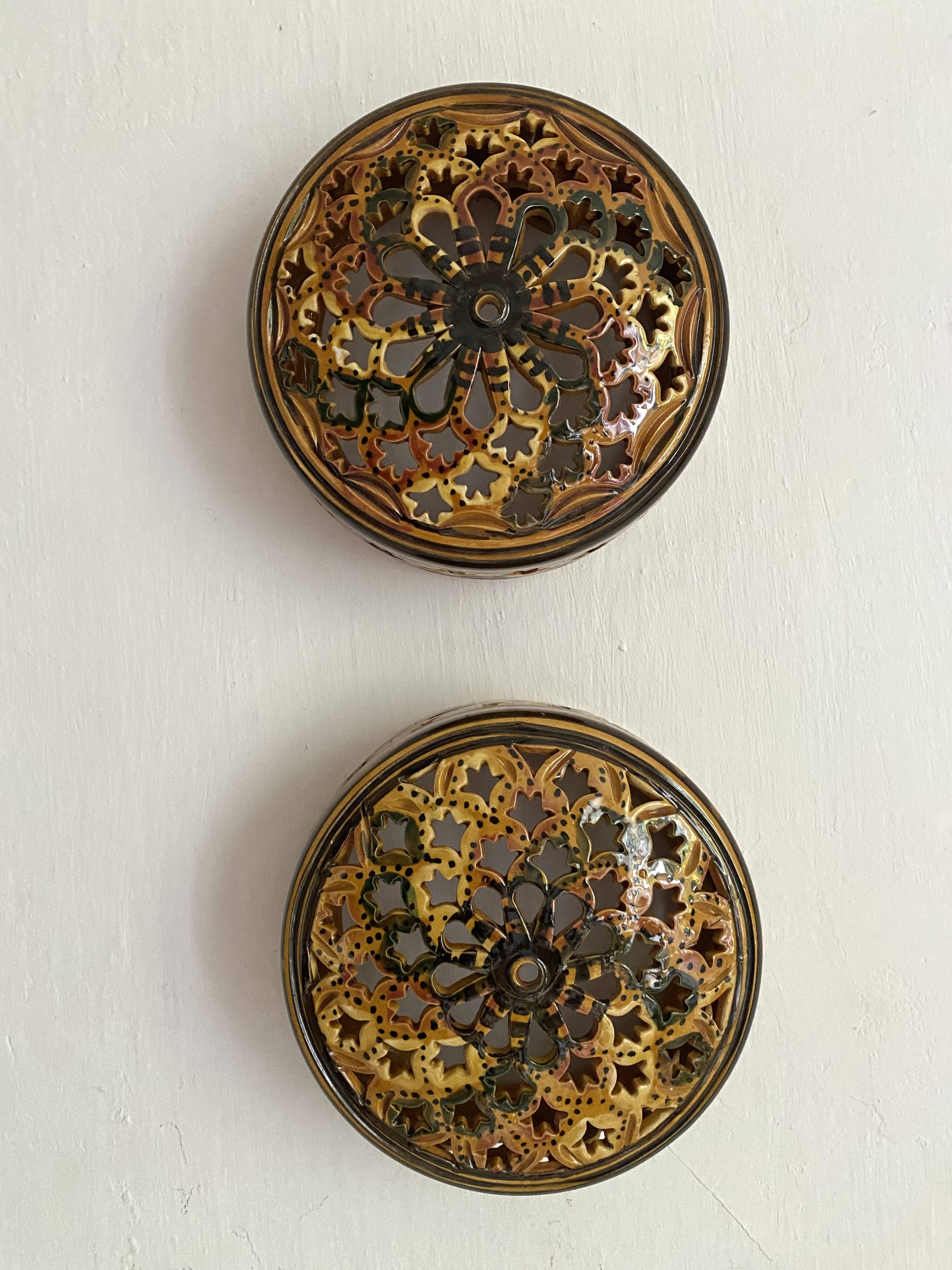 Pair of enamelled terracotta wall lights