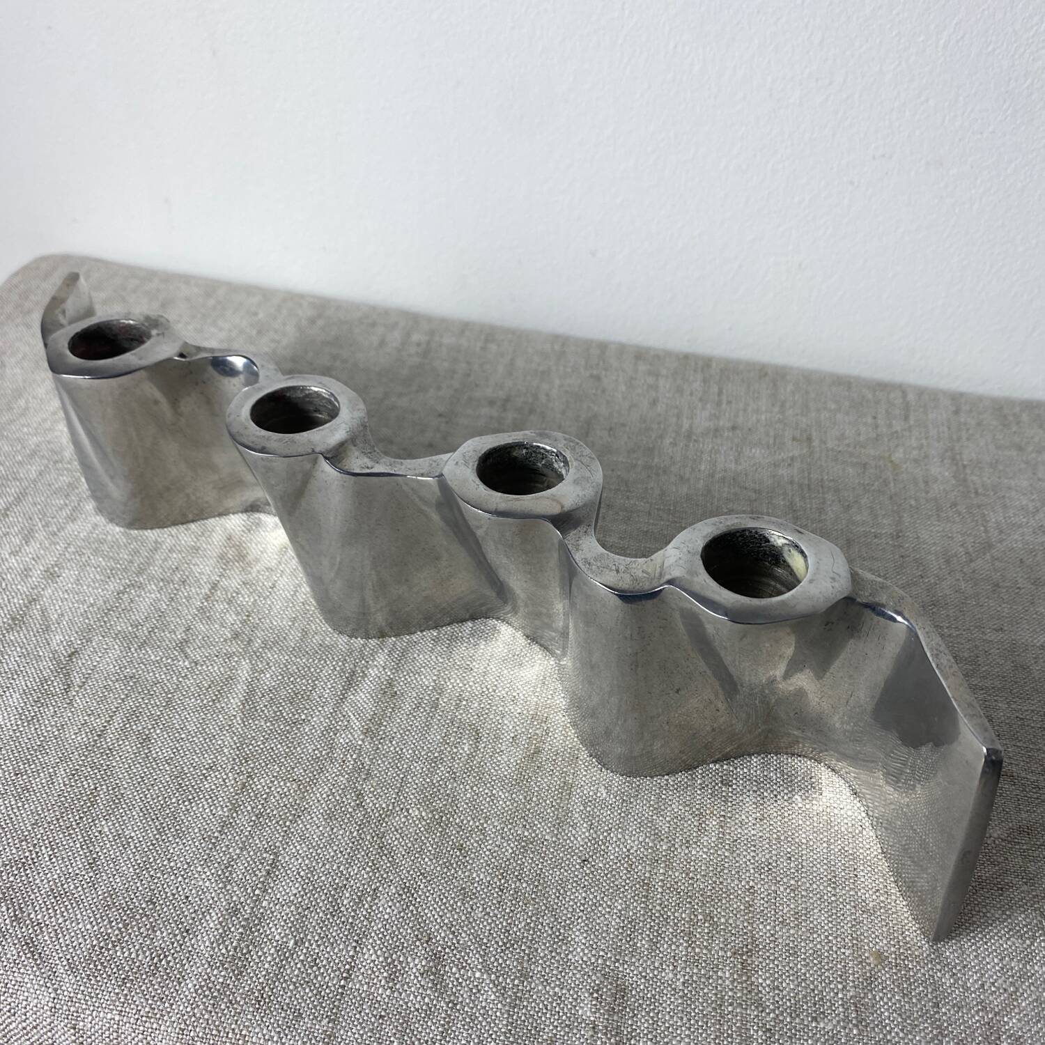 Brushed aluminum candle holder