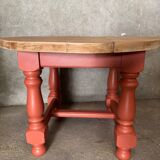 Round coffee table made of solid wood in orange color (soft color)