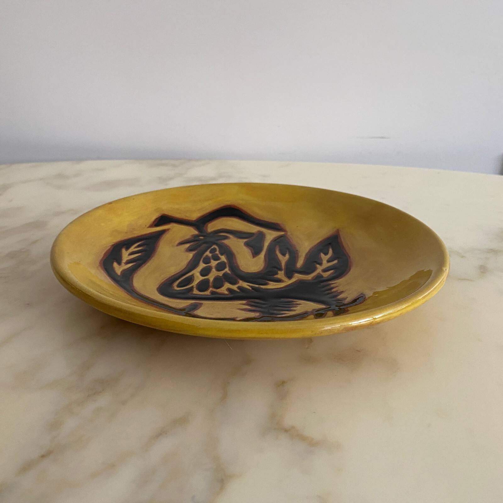 Terracotta plate by Jean Lurçat decorated with a rooster on a yellow background