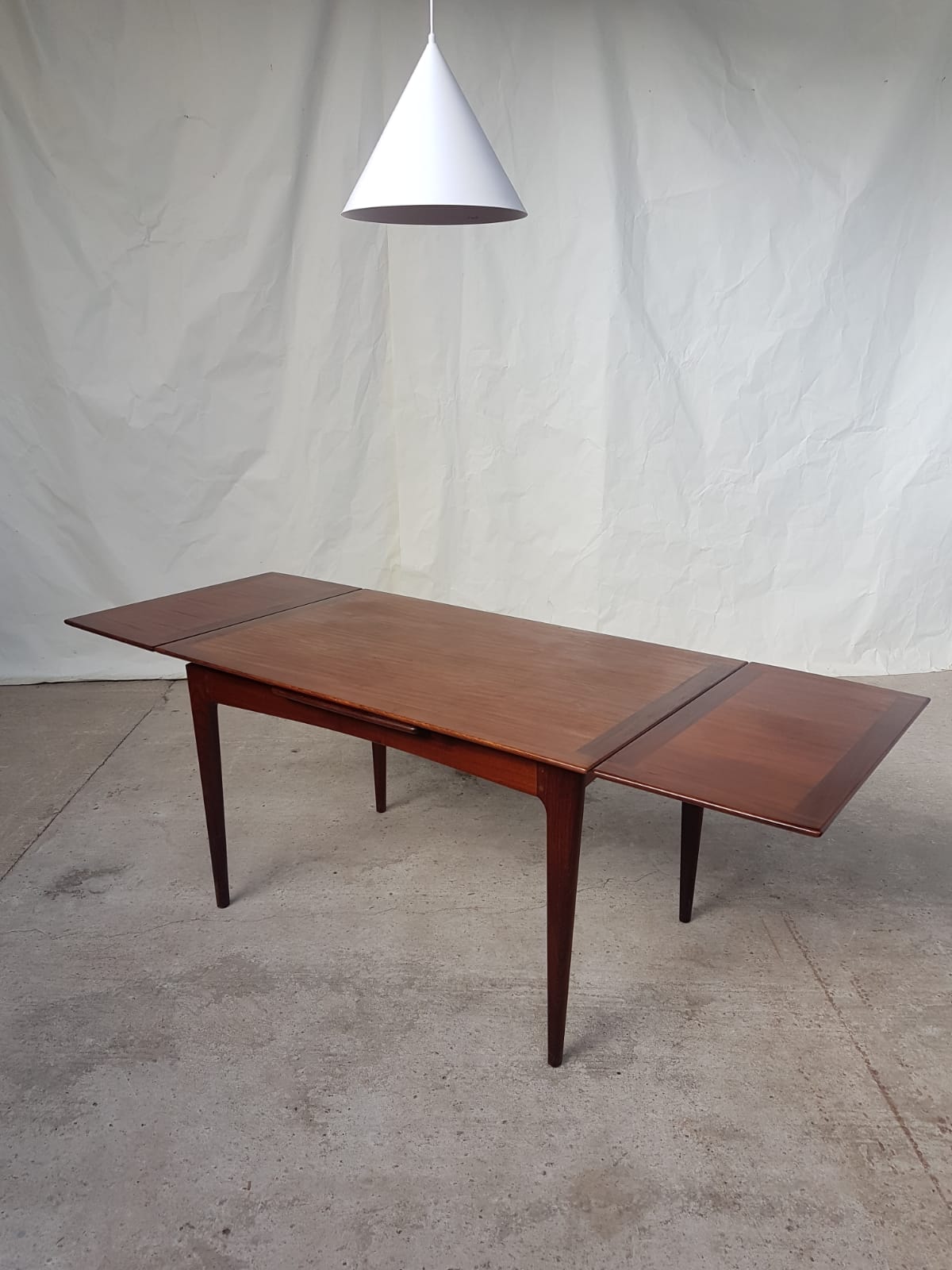 Teak extending dining table by Younger
