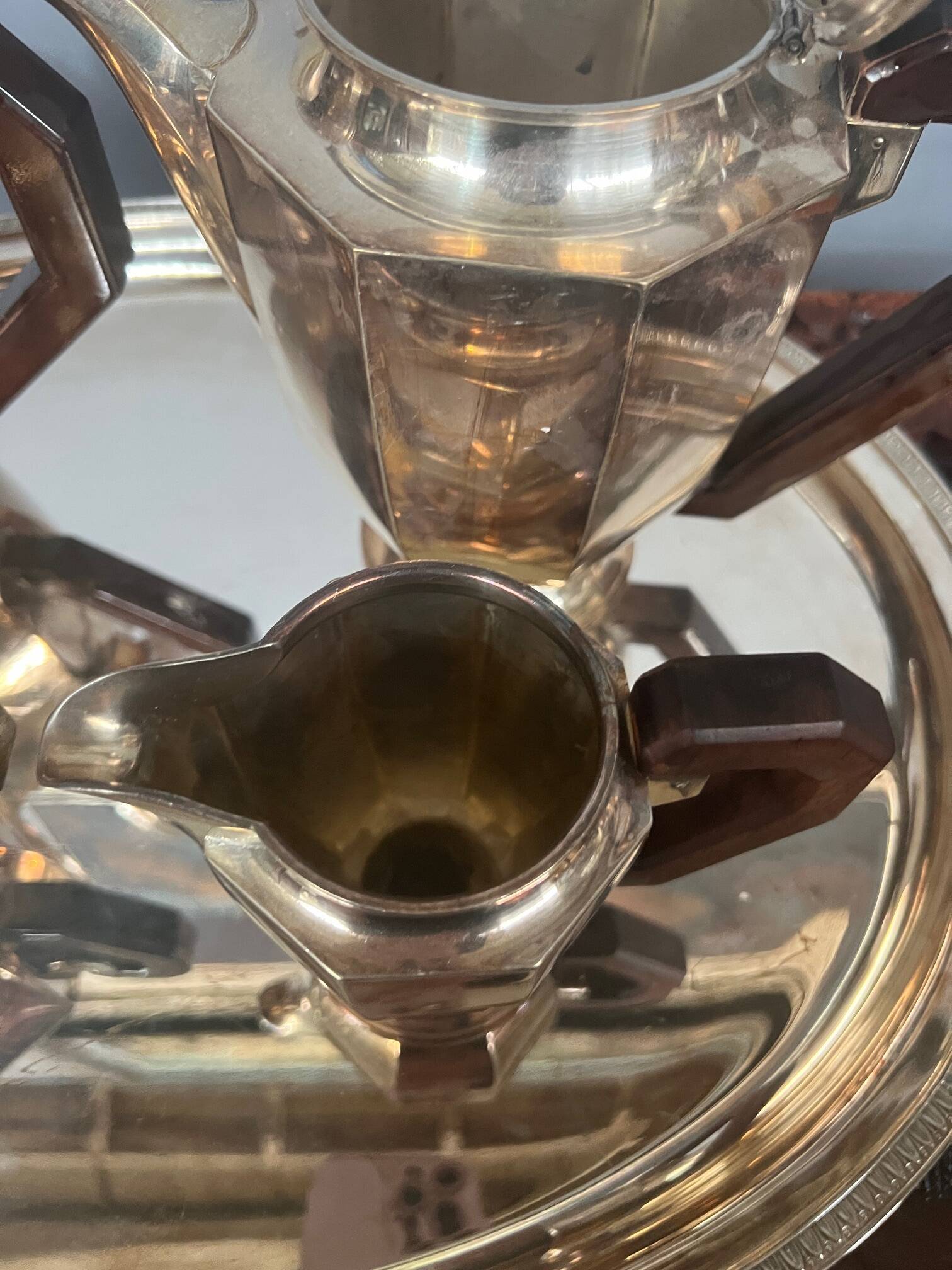 Art Deco tea and coffee service. Silver-plated metal and mahogany.