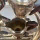 Art Deco tea and coffee service. Silver-plated metal and mahogany.