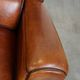 Set of 2 very comfortable large sheepskin armchairs elegantly finished with black piping