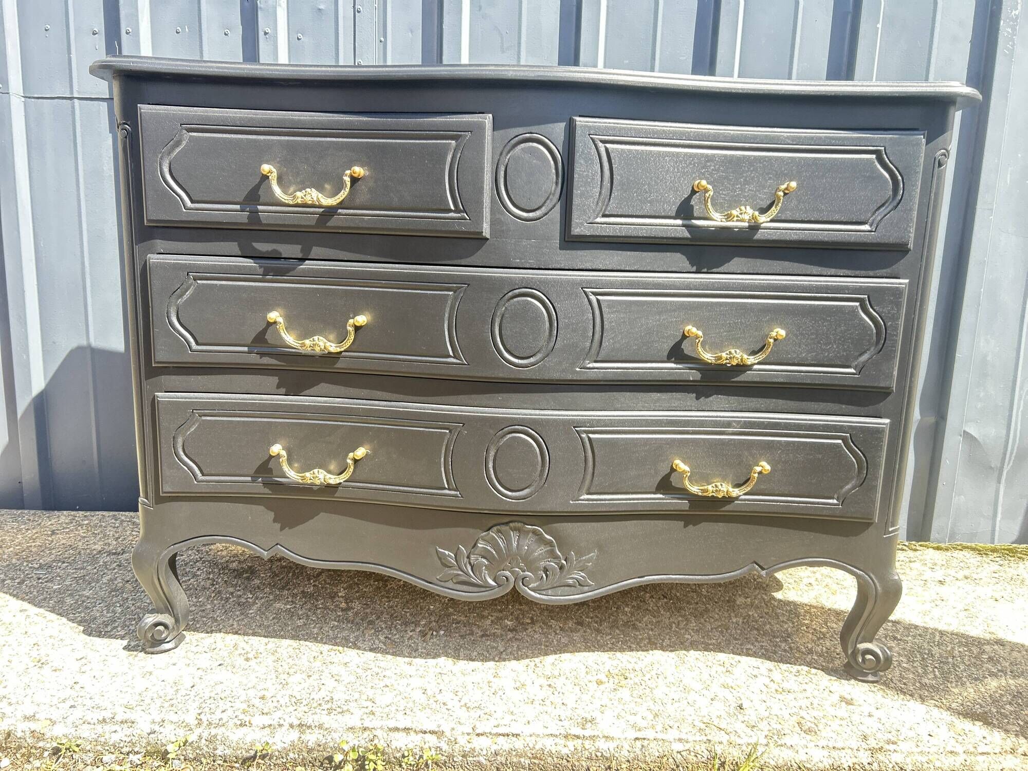 Louis XV style black lacquered chest of drawers with four drawers.