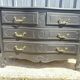 Louis XV style black lacquered chest of drawers with four drawers.