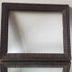Antique wooden frame with geometric carvings light distress