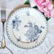 Old mismatched flat plates made of ironstone earthenware.