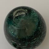 Glass bottle with silver glitter inclusions