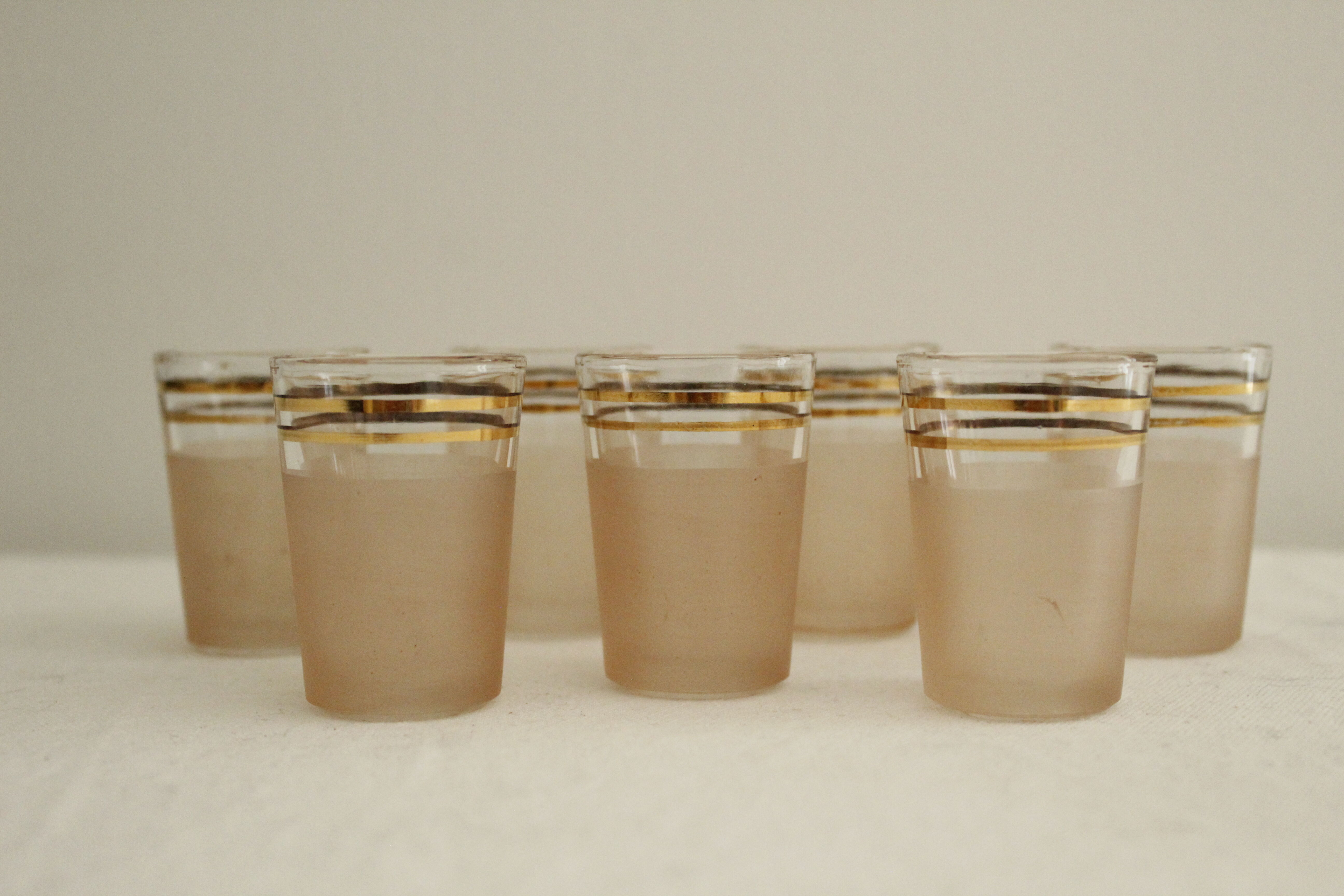 7 pink and gold vintage glass liquor glasses