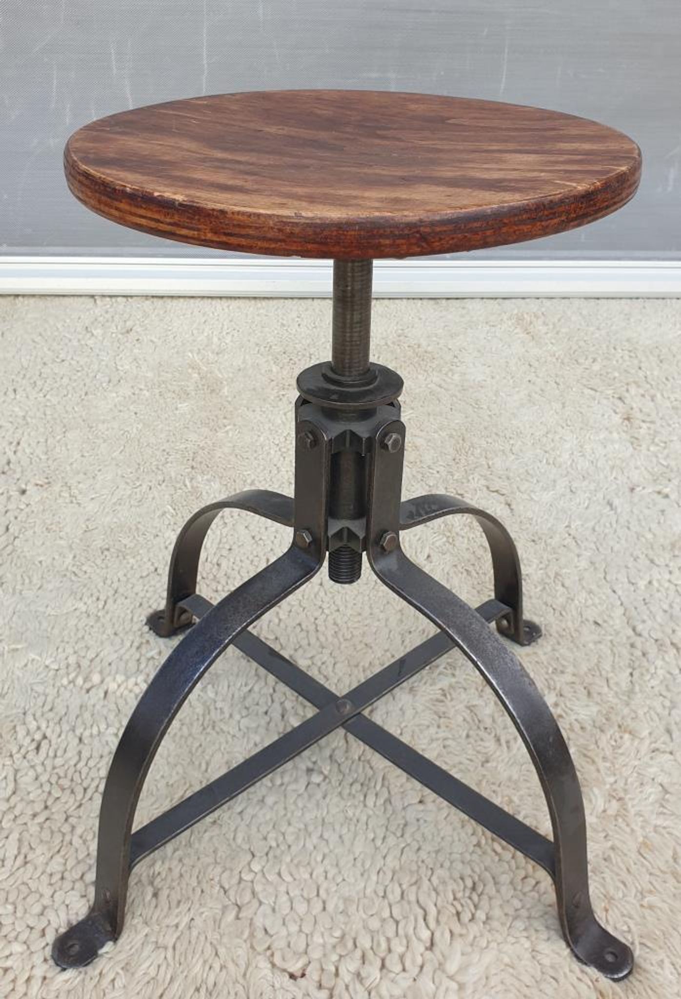 Bienaise stool of the years 1935, model 203 with 4 flat iron cathedral legs joined by a