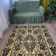 Romanian floral rug handwoven in wool, yellow and black background