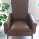 a pair of comfortable vintage armchairs with splayed legs