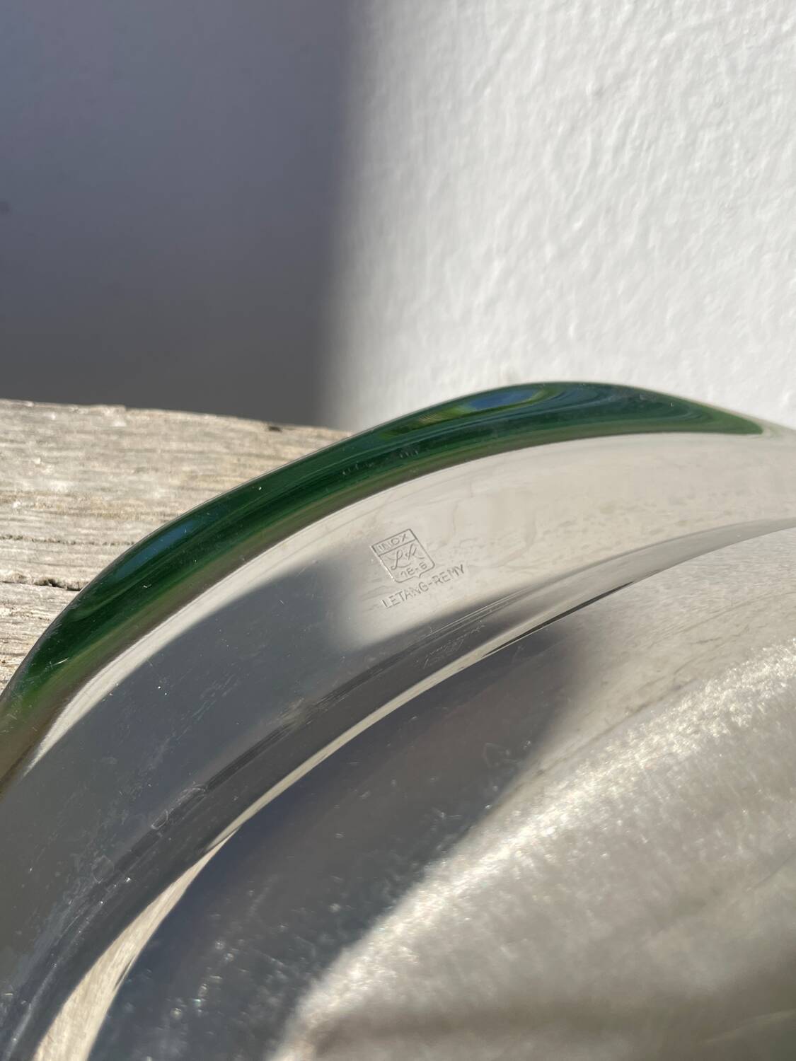 Oval stainless steel dish signed Rémi Letang