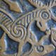 Bas-relief sculpture in terracotta inspired by the Celtic bestiary