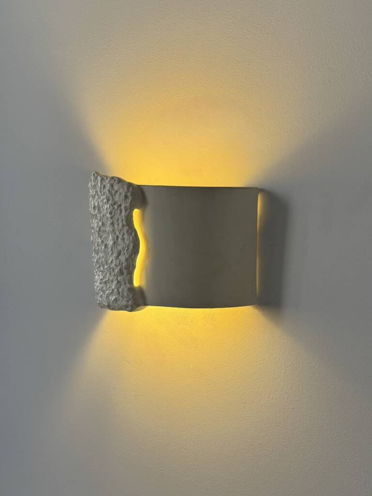 Pair of vintage wall lights in smooth plaster and stone imitation, France, 1970.