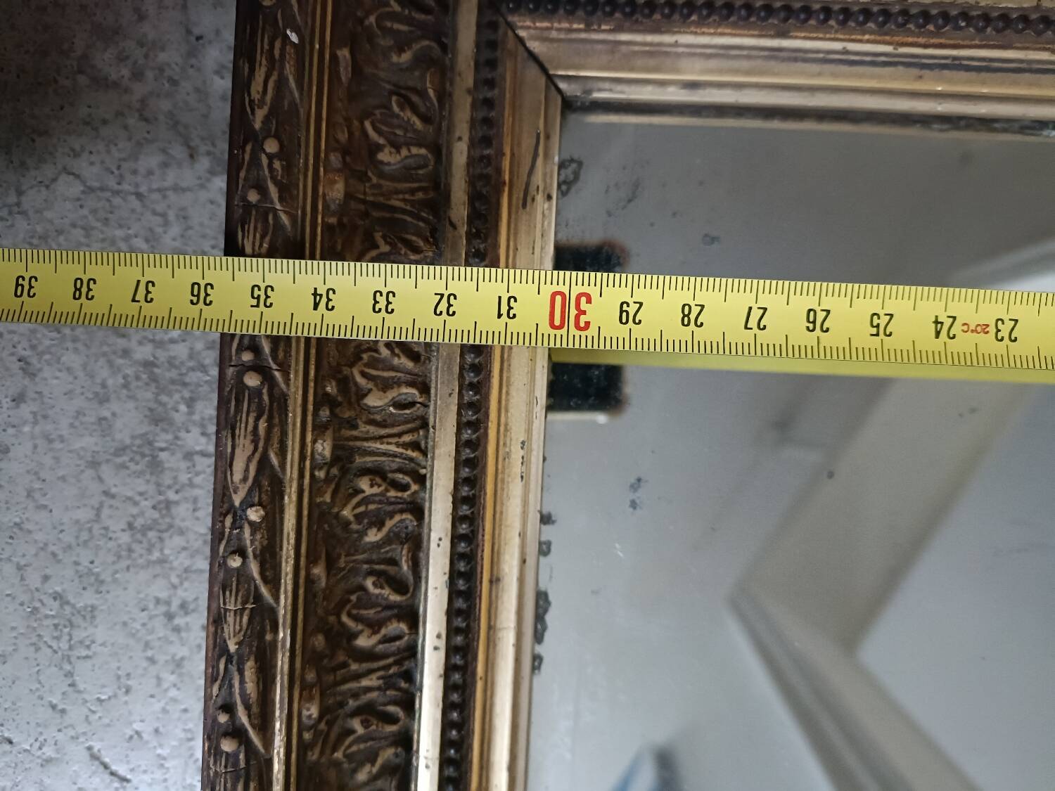 Antique mirror in wood and gilded stucco