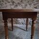 French antique round dining table in walnut, circa 1880–1900.