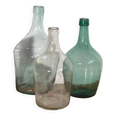 Antique colored demijohns (c.1920). Set of 3 pieces