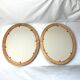 Pair of oval wooden frames with gilding