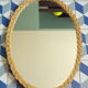 Oval vintage rattan mirror