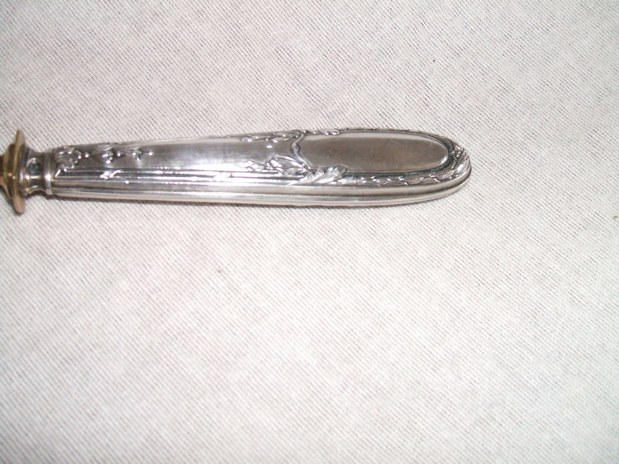 Laouche has creme sleeve silver