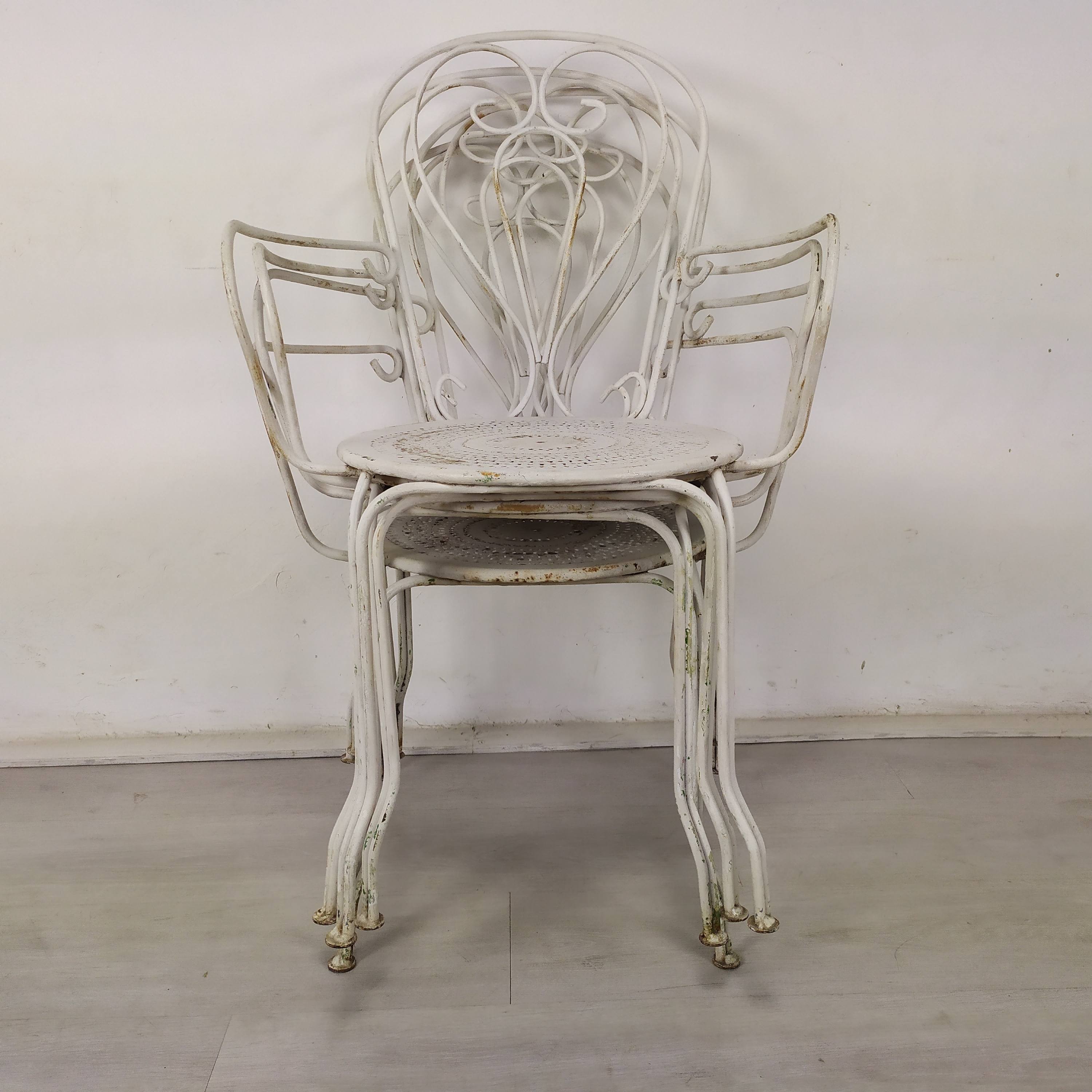 4 wrought iron garden armchairs