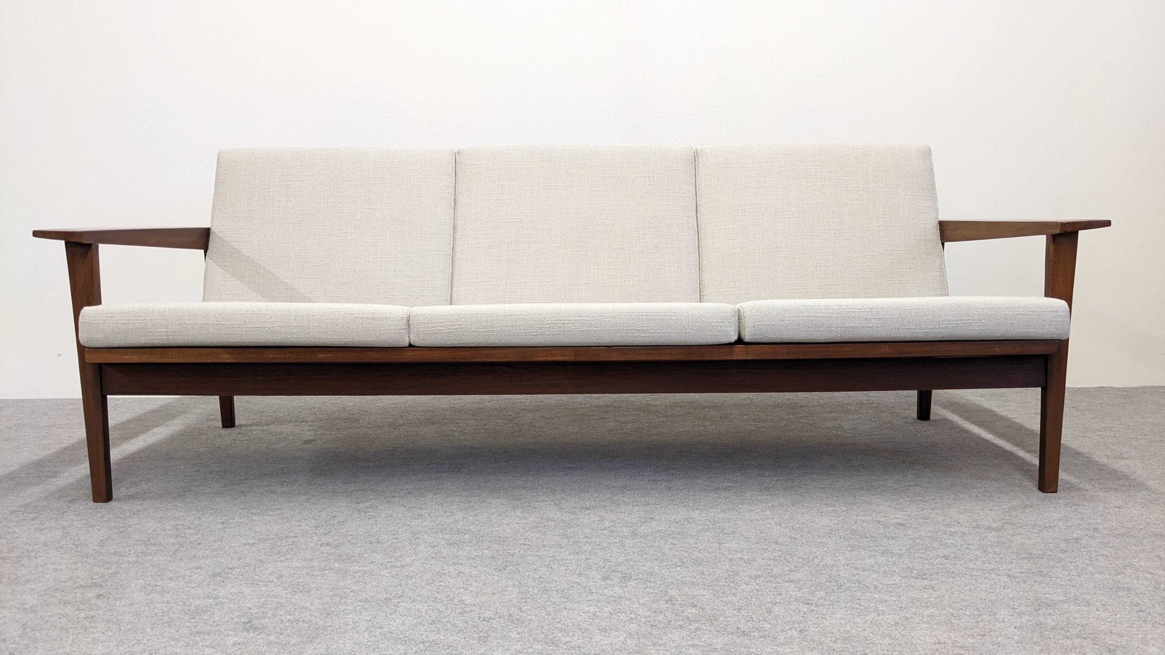 Three-seater modernist teak sofa, France circa 1950.