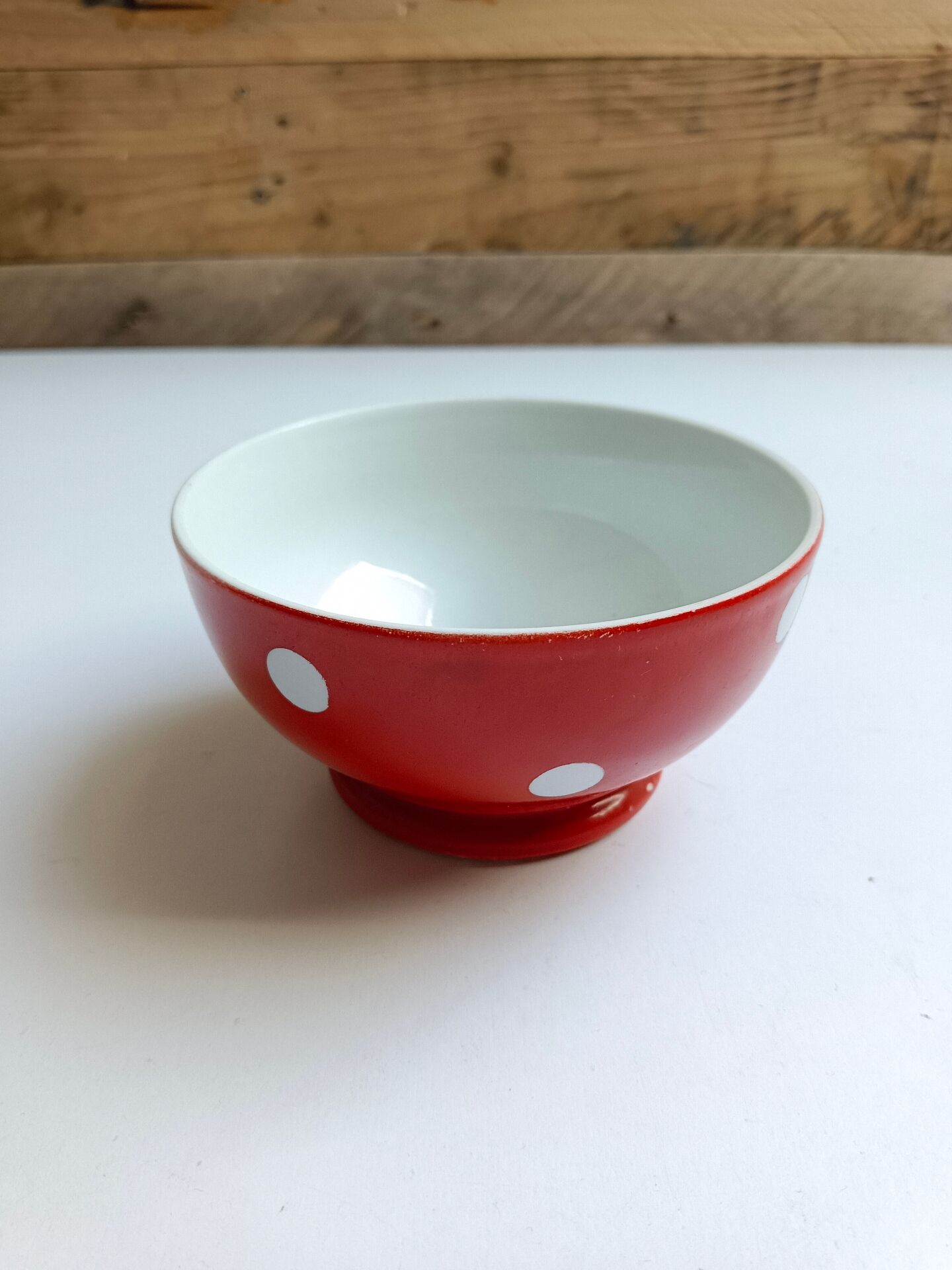 Red bowl with white polka dots in Longchamp ceramic