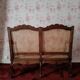 Antique carved solid wood bench with wicker caning.