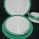 Paris porcelain set of 3 plates and a sauce boat with green border and gold monogram JC.