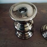 Two bronze-colored candlesticks