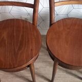 Set of 4 Baumann bistro chairs with round seats.