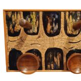 Vintage wooden coat hangers and glazed copper