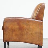 Art Deco design sheepskin leather armchair with a stunning patina