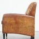 Art Deco design sheepskin leather armchair with a stunning patina